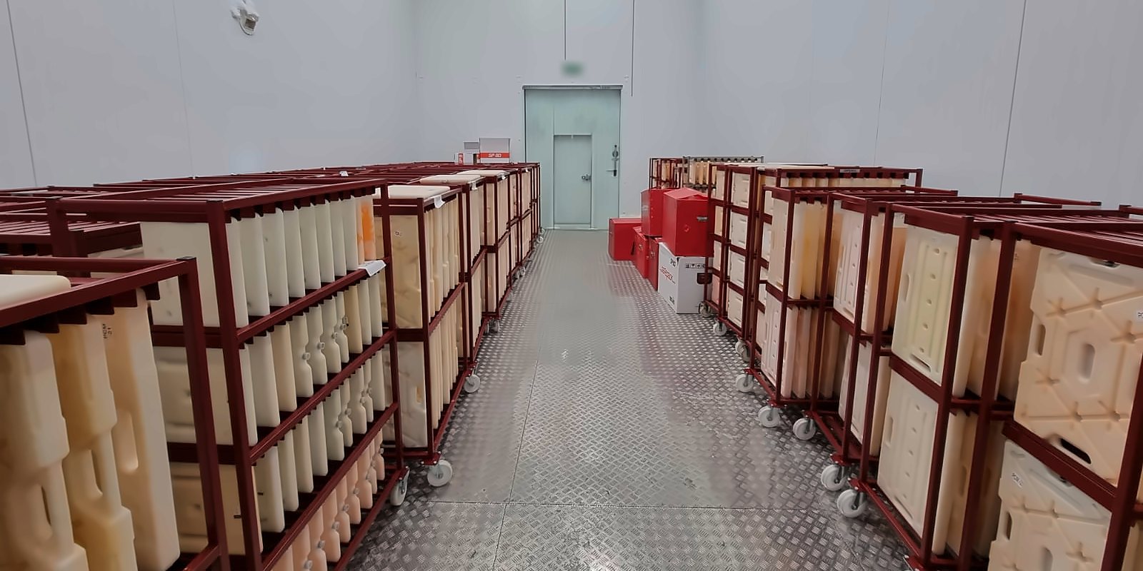 A PCM conditioning room with trolleys of phase-change packs in a BIOCARD Group facility