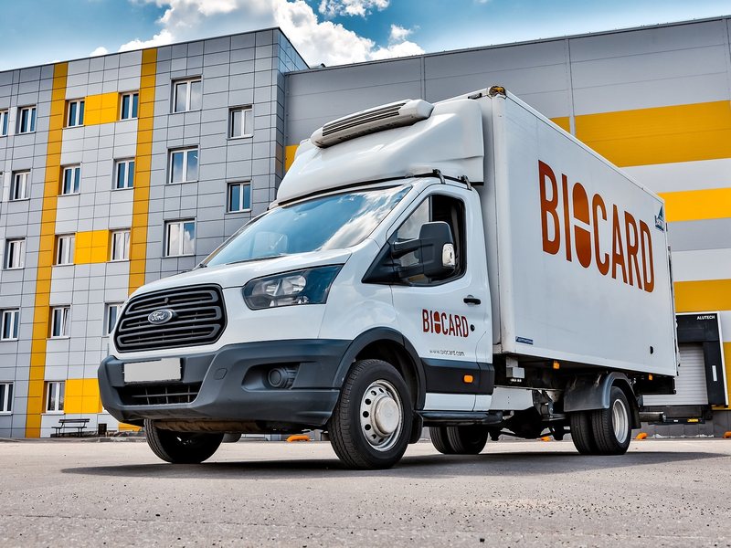 A BIOCARD refrigerated Ford Transit van at a warehouse loading dock