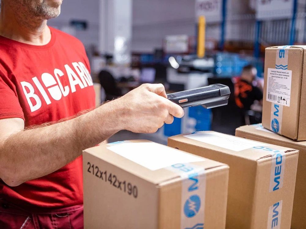 A warehouse operator scanning parcels